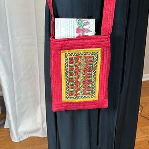 Bohemian embroidered crossbody bag in vermillion color.